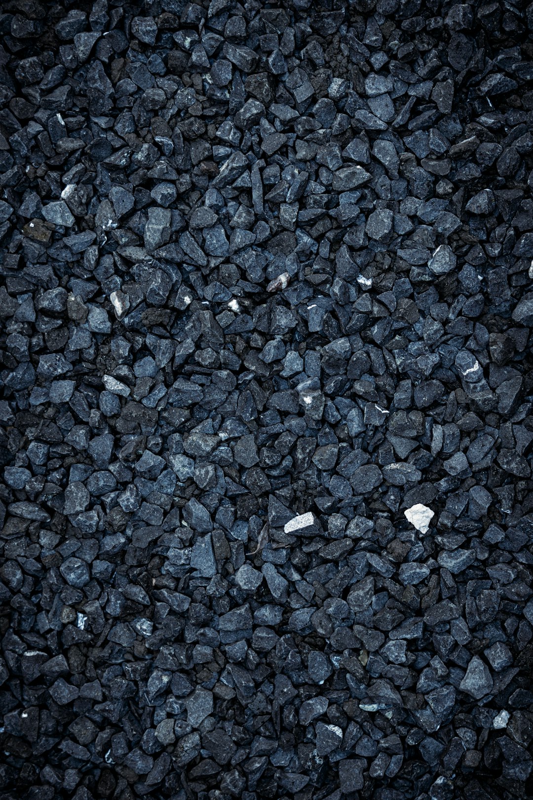 Black gravel background, high resolution, ultra realistic photography –ar 85:128