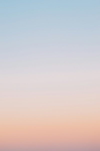 A pastel gradient sky background with soft blue, pink, and orange tones, low contrast, minimalist, calm, and tranquil mood, suitable for digital backgrounds or web design, no text in the center of the frame, in the style of minimalist landscape art. --ar 85:128