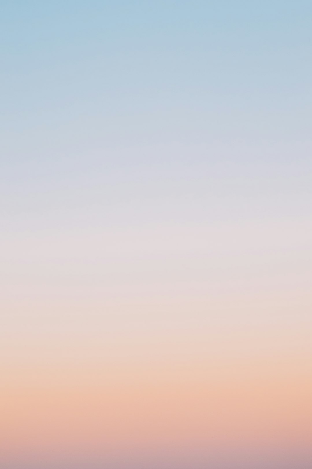 A pastel gradient sky background with soft blue, pink, and orange tones, low contrast, minimalist, calm, and tranquil mood, suitable for digital backgrounds or web design, no text in the center of the frame, in the style of minimalist landscape art. –ar 85:128