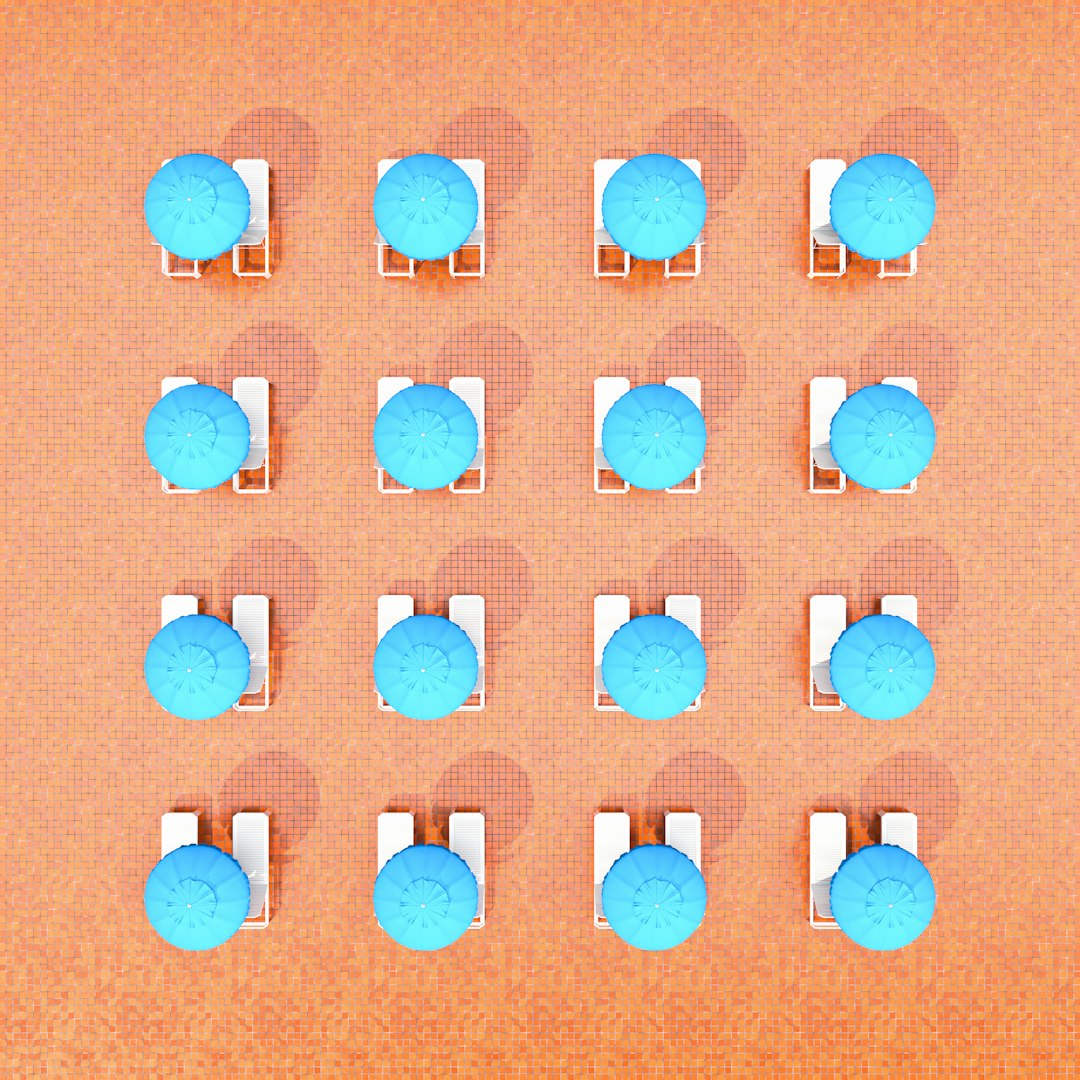 3d render of beach chairs and umbrellas arranged in rows on an orange background, top view, minimalistic, simple shapes, blue tones, symmetrical composition, high resolution