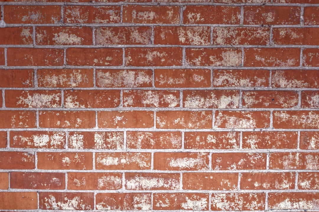 Red brick wall background with white paint texture, –ar 128:85