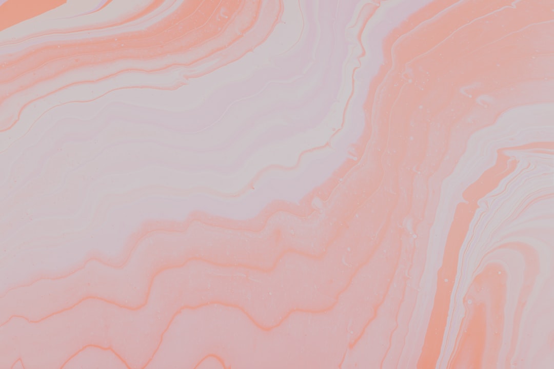 Abstract peach marble pattern, soft pink and white swirls for a dreamy background in the style of no artist. –ar 128:85