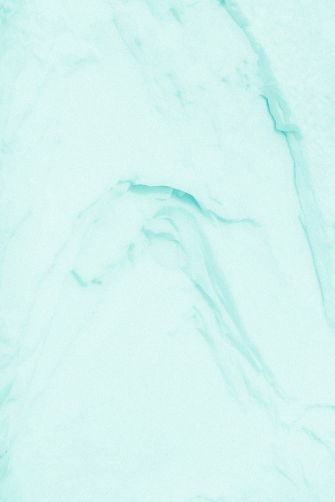 A close up of an ice background with a light blue, mint green and white color palette, in a pastel aesthetic style, with flat lay photography on a minimalist background, with a high resolution. –ar 85:128