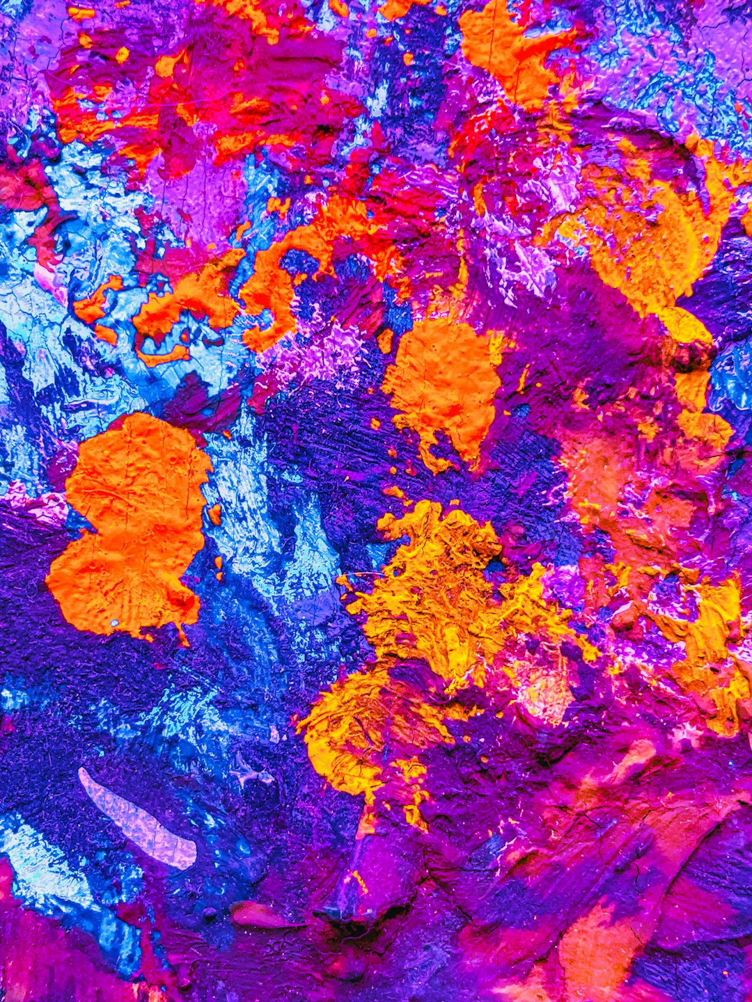 Abstract painting of vibrant purple, blue and orange paint splashes, with intricate patterns resembling natural elements like leaves or flowers. The colors create an artistic background that would be great for design projects related to nature, artistry, creativity, or color contrast. It could also make an eyecatching element in digital marketing materials. –ar 3:4