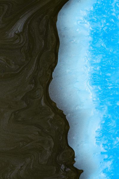 Black sand and blue water, closeup, high angle view, texture detail, aerial photography, abstract, minimalism, high resolution, high definition --ar 85:128