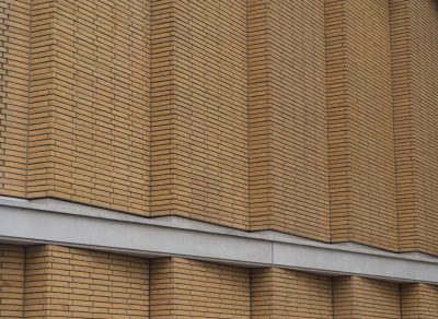 photograph of beige brick wall facade with horizontal lines, building in Tokyo by [Kengo Kuma](https://goo.gl/search?artist%20Kengo%20Kuma) , close up detail photo, --ar 128:93