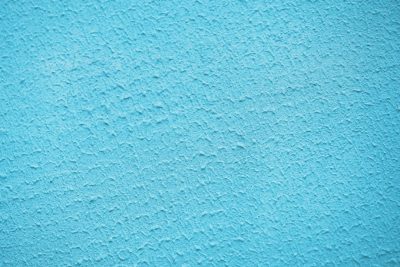 Light blue plaster wall background, closeup, high resolution photography, high quality photo --ar 128:85