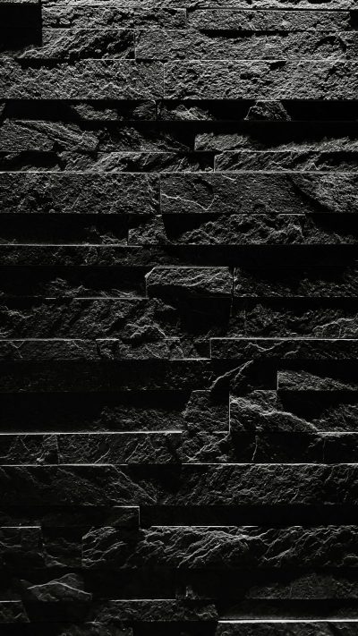 black stone wall, minimalistic, simple, dark background, black and white, high contrast, low angle shot, straight on, front view, texture, depth of field, ultra realistic, cinematic lighting, high resolution photography --ar 9:16