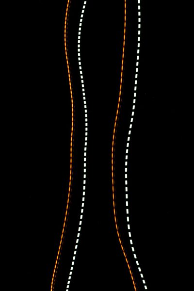 White dotted lines on black background, orange and white color scheme, three rows of vertical linear lighted stripes, female curves, body shape --ar 85:128