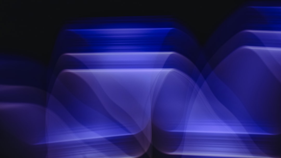 abstract blue shapes and lines on black background, motion blur, low angle view, dark violet light, minimalism, blurred, –ar 16:9