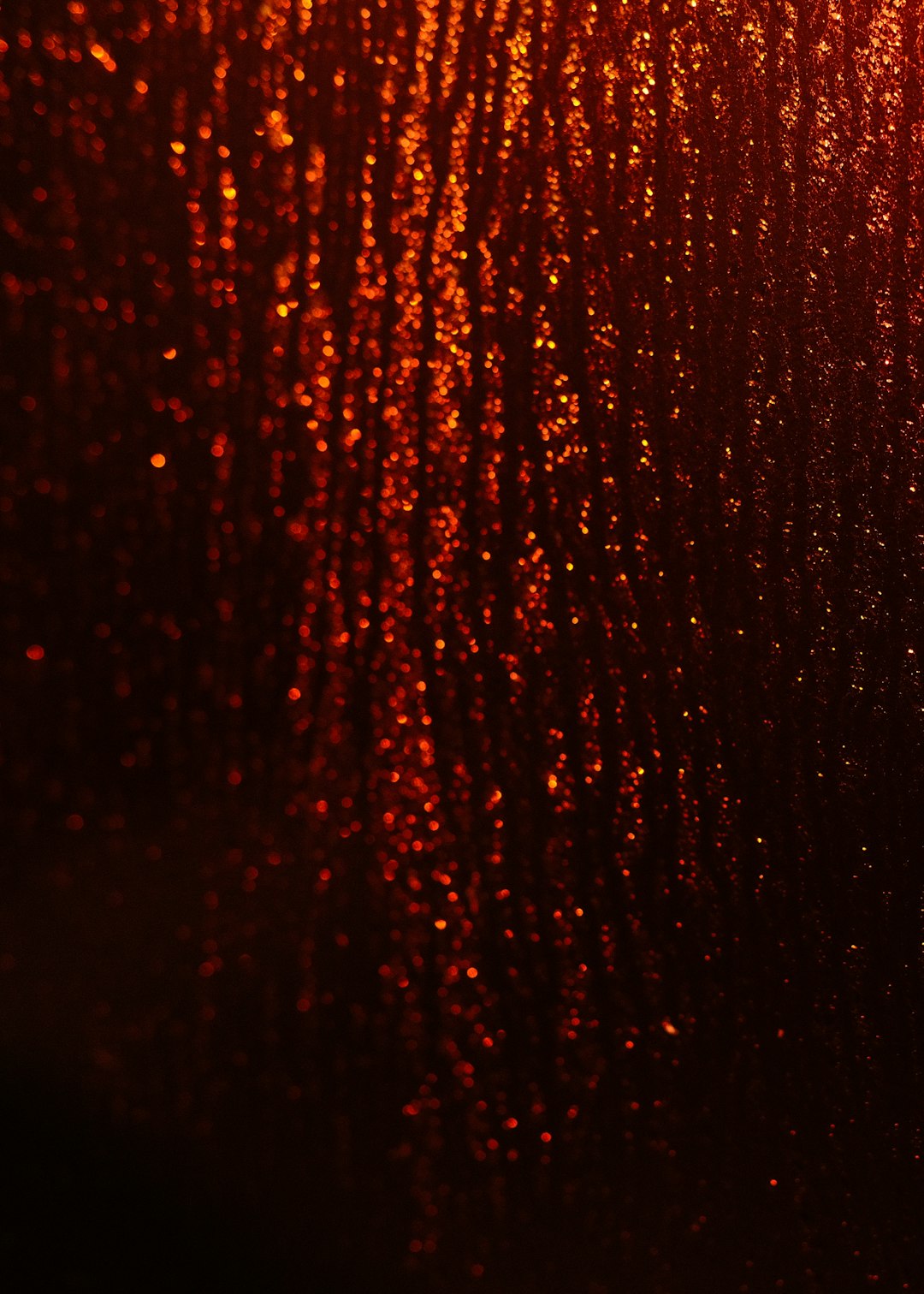 Red glitter background, red rain drops on the glass, dark red and orange tones, depth of field, blurred light spots, closeup, photography style, ultrahigh definition resolution. –ar 91:128