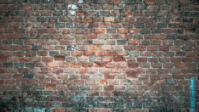 Old brick wall background with copy space, detailed, high resolution photography, stock photo --ar 16:9