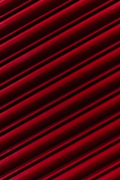 Red velvet background with diagonal lines, high resolution image, Canon R5 camera, 80mm lens, f/2.4 aperture. --ar 85:128