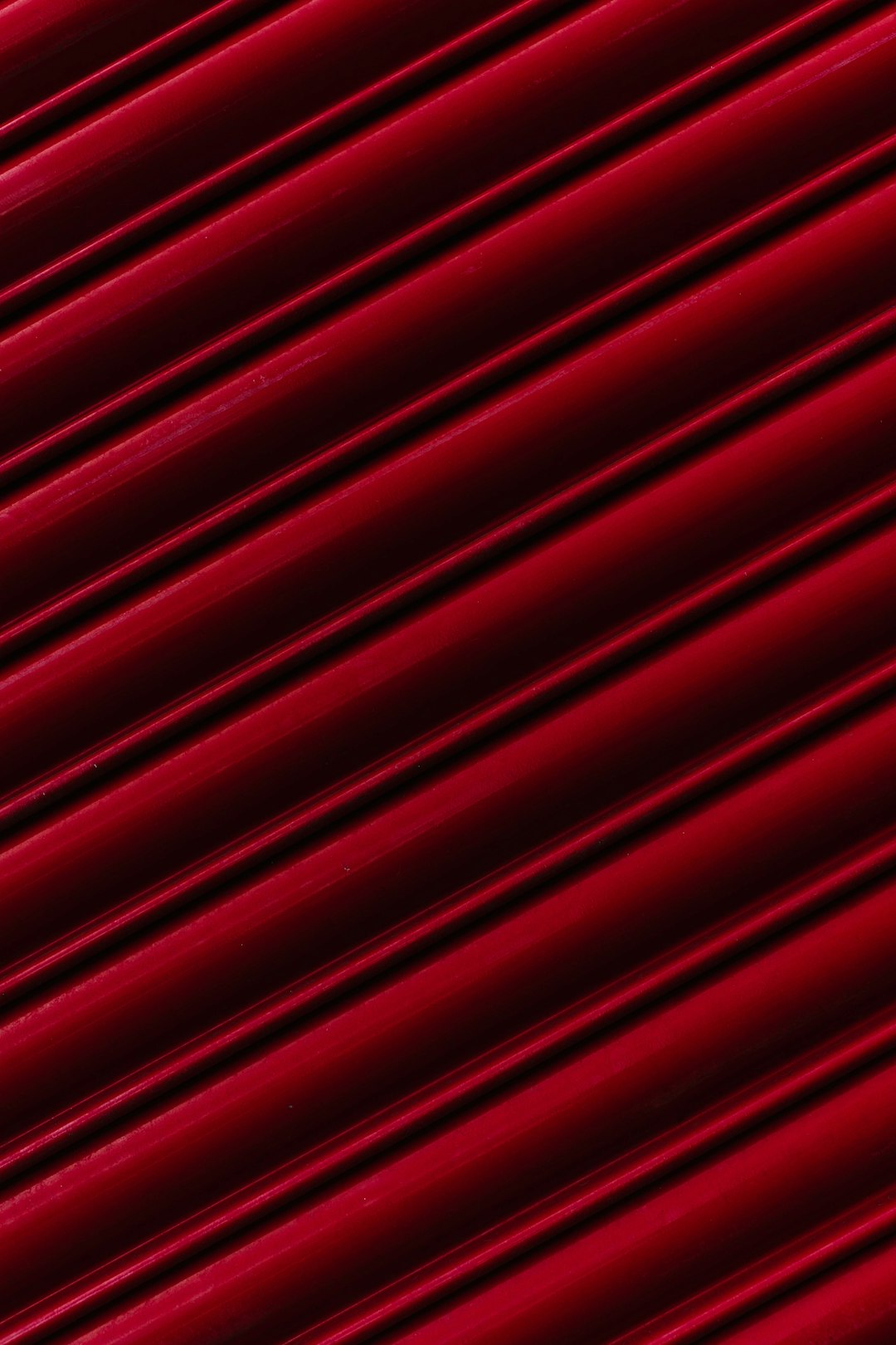 Red velvet background with diagonal lines, high resolution image, Canon R5 camera, 80mm lens, f/2.4 aperture. –ar 85:128