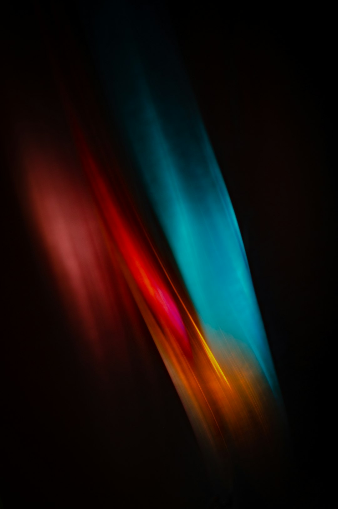 abstract blurred light streaks of color on black background, simple minimalistic color photography in the style of ron gonsalves and kellyAMI muted colors –ar 85:128