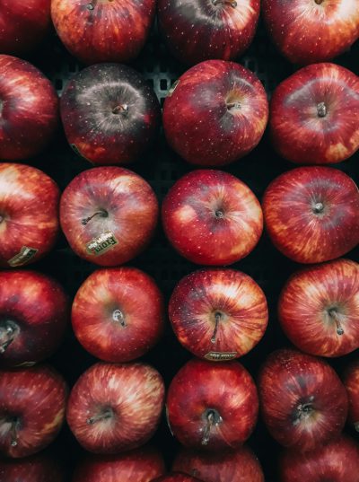 Red apples in the grocery store, close-up shot, top view, in the style of unsplash photography. --ar 95:128