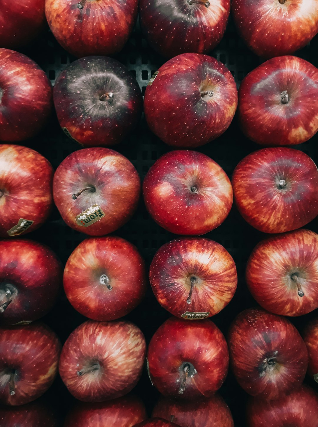 Red apples in the grocery store, close-up shot, top view, in the style of unsplash photography. –ar 95:128