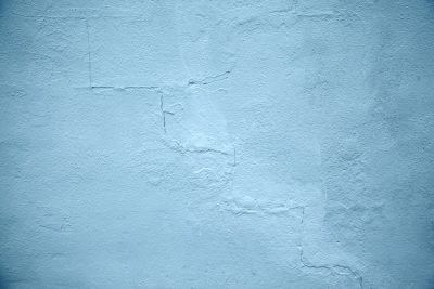 Light blue wall background, simple, with small cracks and worn edges, high resolution, high quality --ar 128:85