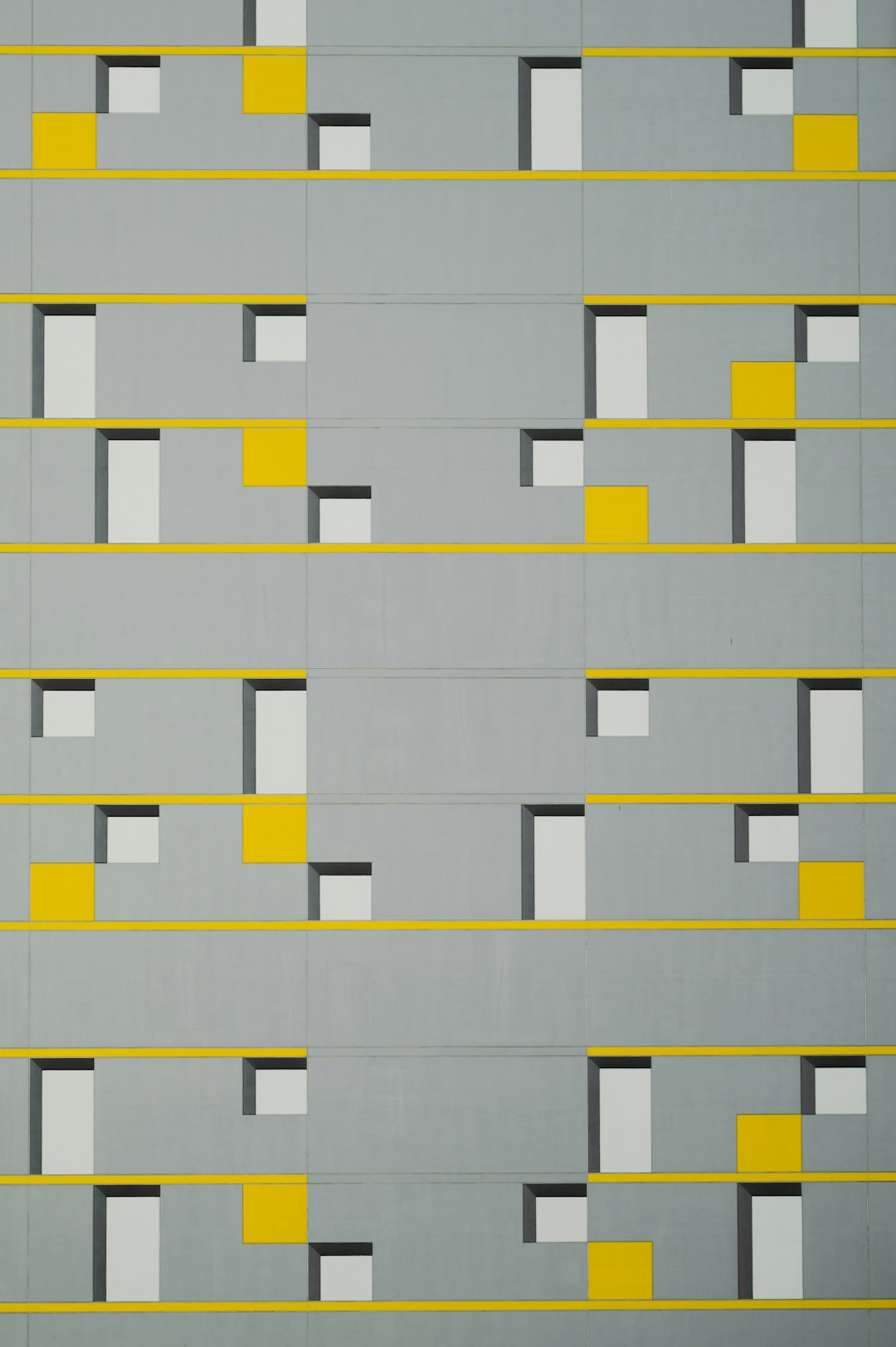 A grey and yellow wall with squares, by Ivan Chermayeff style –ar 85:128