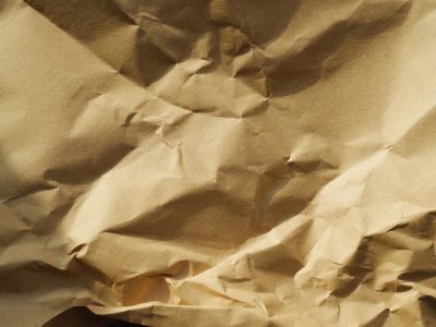 a close up of brown crumpled paper with some creases in it --ar 4:3