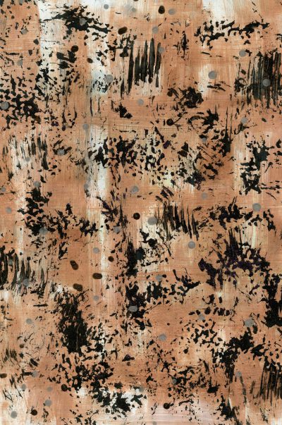 A print with an abstract pattern of small, dark brown and black ink splashes on a light pinkish beige fabric. The background is a solid muted color. --ar 21:32