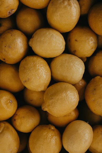 A pile of lemons, close-up top-down view, food photography, in the style of Unsplash. --ar 85:128