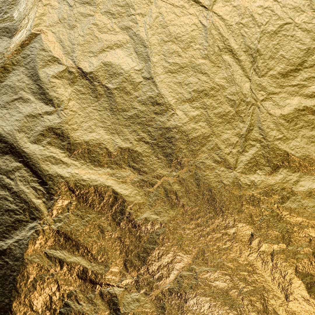 gold foil texture, top view of mountain landscape, high resolution