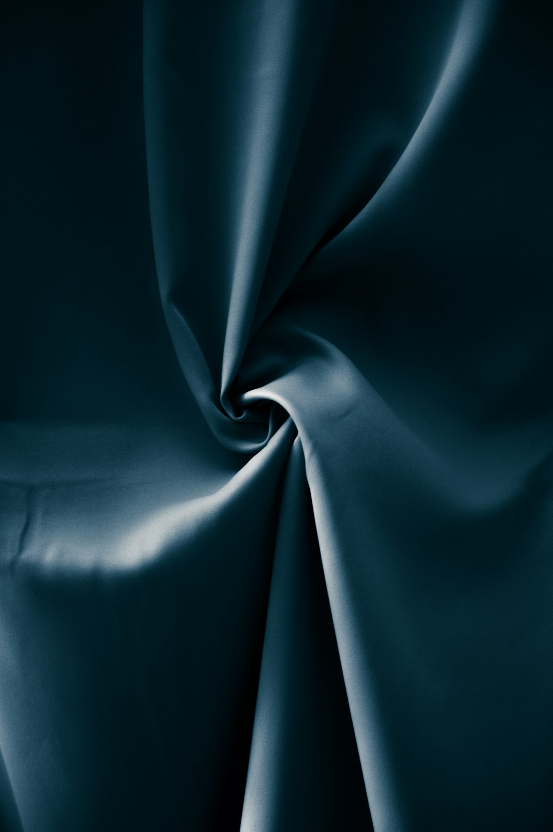 A dark teal silk fabric, close up, smooth and shiny, in a studio setting with soft lighting, captured in the style of photographer [Rineke Dijkstra](https://goo.gl/search?artist%20Rineke%20Dijkstra). –ar 85:128