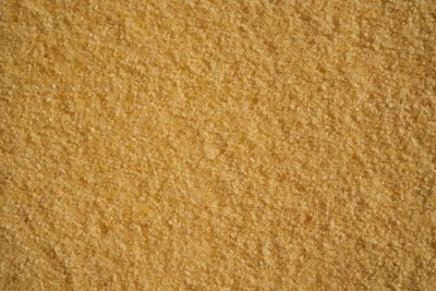 A top view of golden brown sugar, textured background, no shadows, no text, no logo, no letters, no word mark, no typography, no shading --ar 128:85