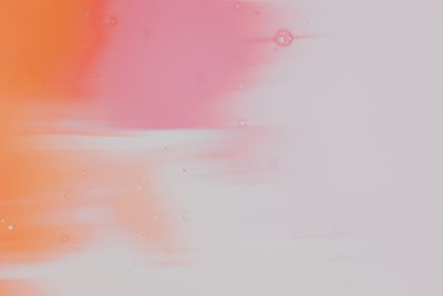 Soft pink and orange gradient, white background, blurred color painting in the style of, small bubbles of air in the middle, large empty space on top. --ar 128:85