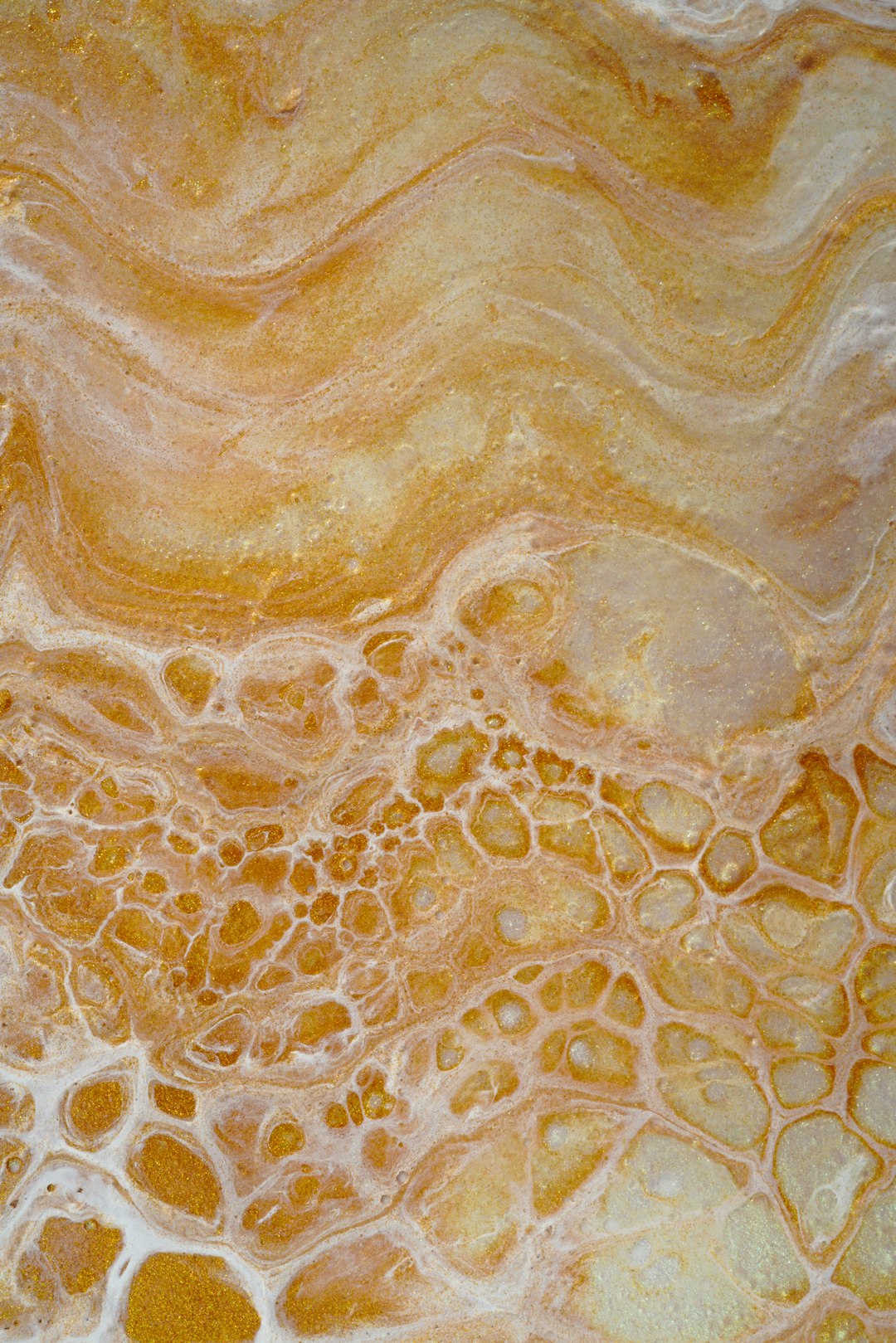 A closeup of the surface texture of marble, showcasing its intricate patterns and warm tones in shades of orange and yellow. The pattern is made up of delicate swirls that give it an elegant appearance. Inhale, intricate lines of swirling colors on top. Top view, light background, natural lighting, hyperrealistic photography. –ar 85:128