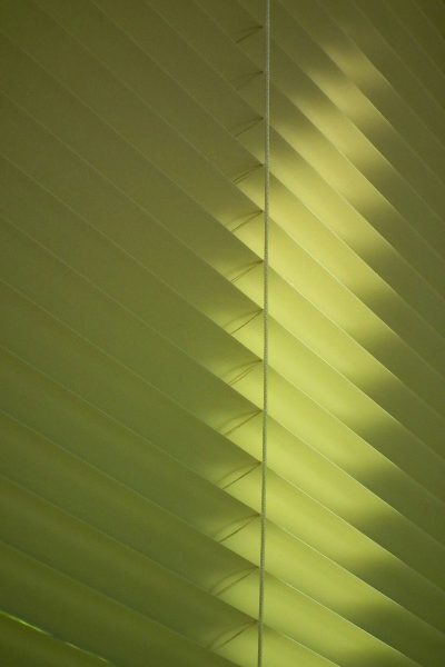 photo of light green blinds, low angle shot, soft shadow, detail, macro photography --ar 85:128