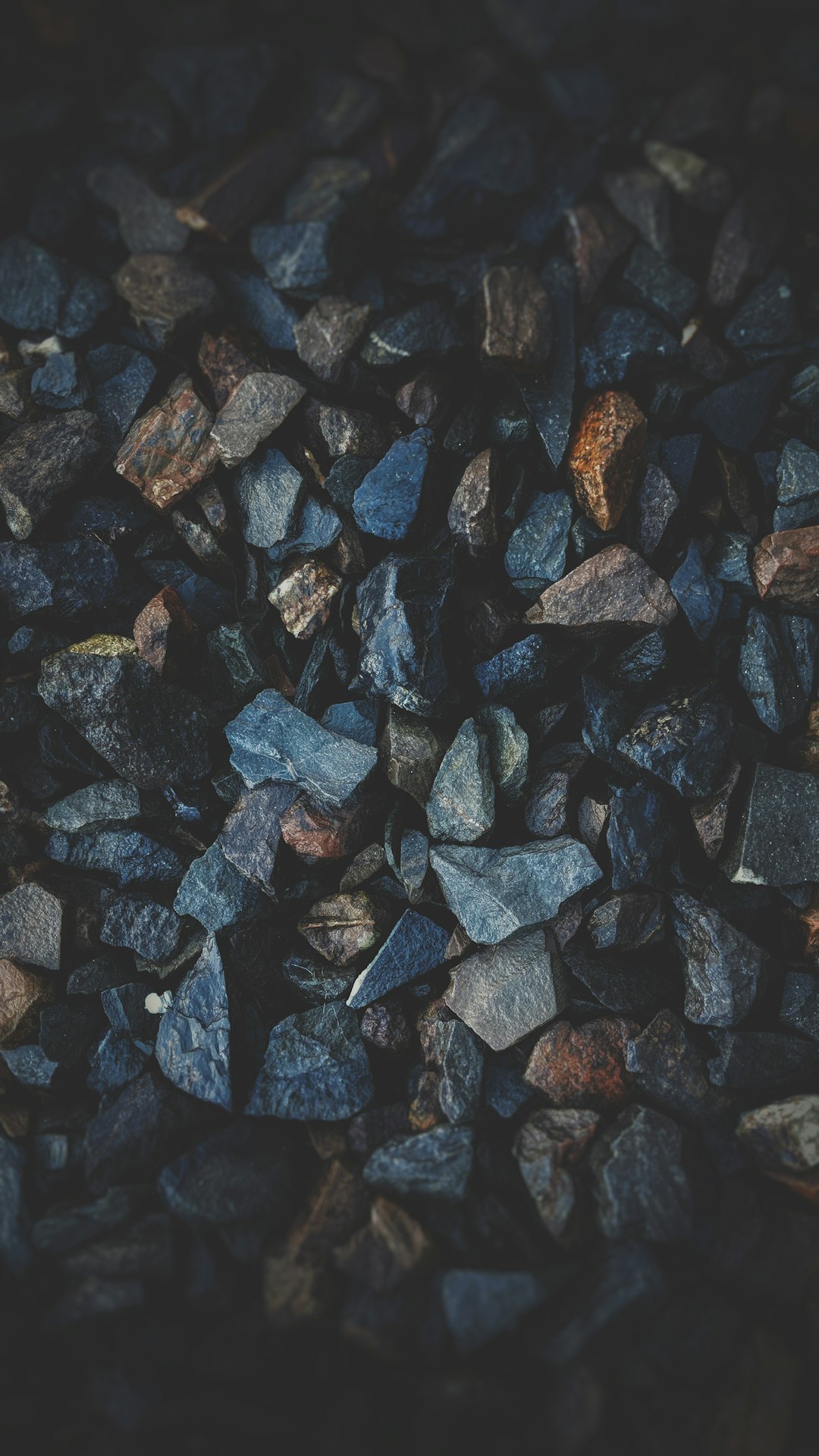 Dark grey rocks, texture, top view, mobile wallpaper, dark background, minimalistic, simple, depth of field, bokeh effect, macro photography, in the style of professional photo –ar 9:16