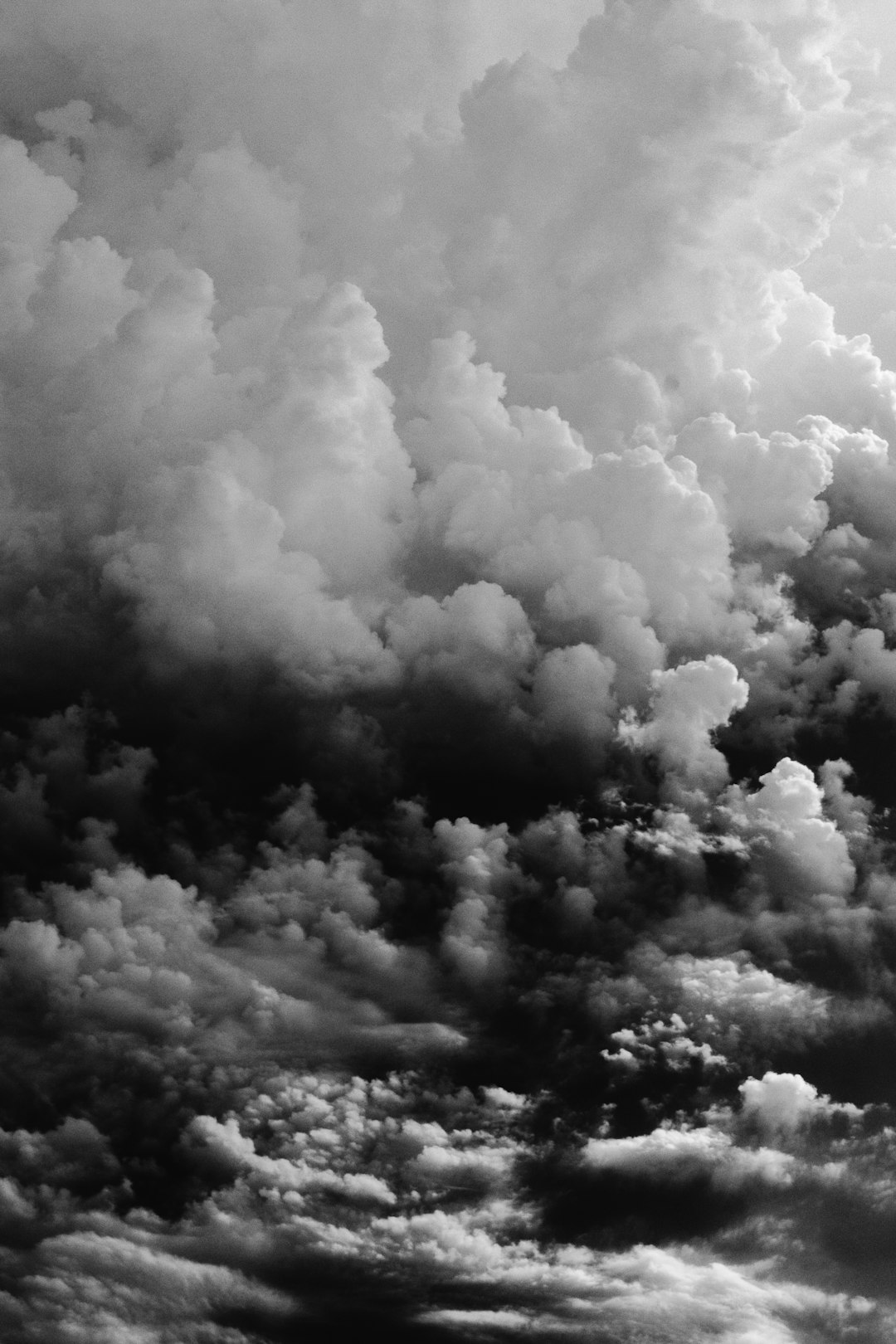 Black and white clouds, hyper realistic, high resolution photography in the style of unknown artist. –ar 85:128