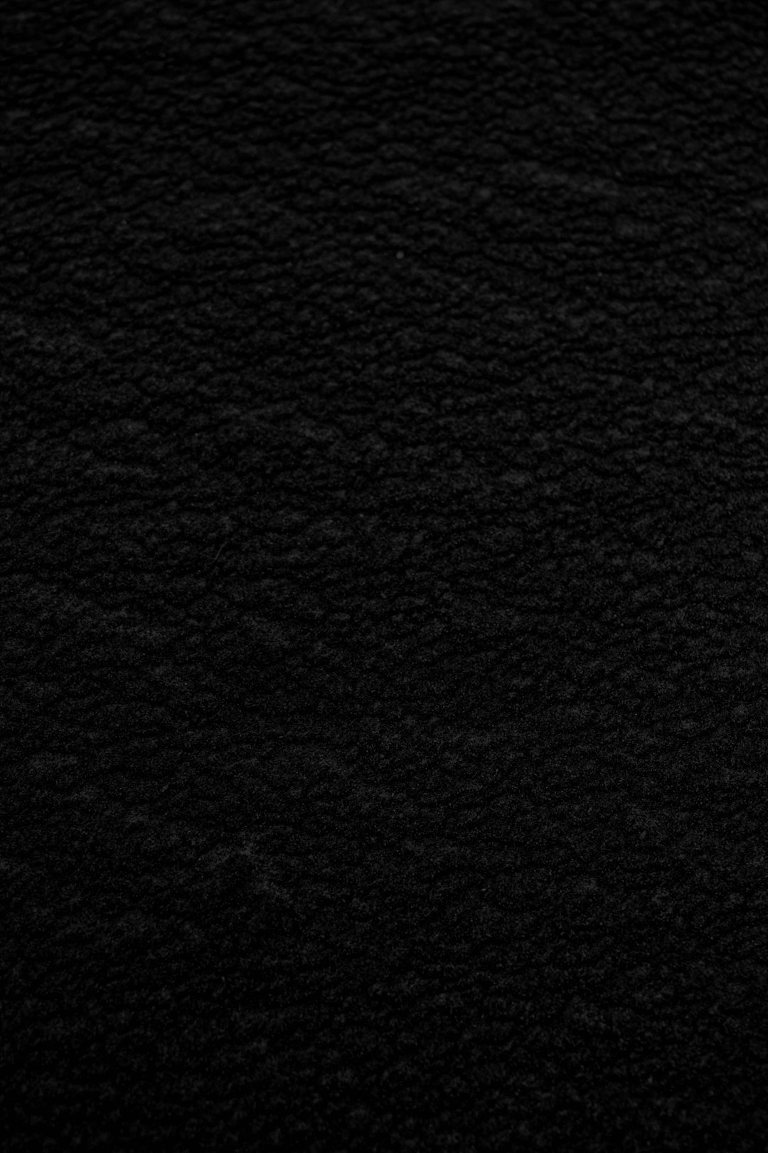 Black background, top view of the black leather texture, flat, high resolution, high detail, high quality, high definition, high contrast, professional color grading, soft shadows, no hard edges, no grainy textures, no fine lines, no blur effect, no harsh lighting, no light and dark areas –ar 85:128