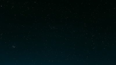 A dark night sky with stars, minimalistic and simple clean background, ultra realistic cinematic style. --ar 16:9