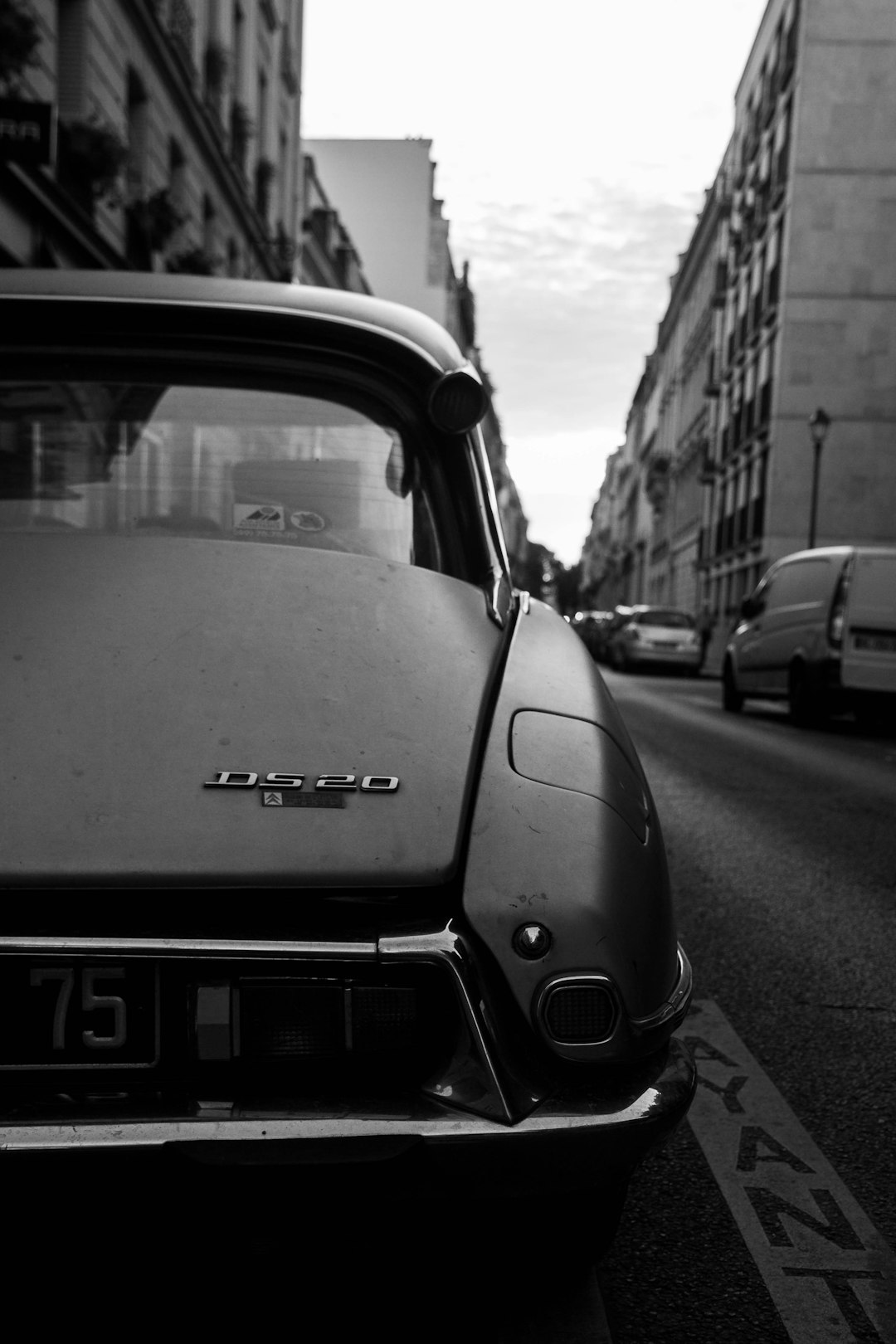 close up of front end view, black and white photograph of an open roofed grey “, peugeot” citroen by [Dieter Rams](https://goo.gl/search?artist%20Dieter%20Rams) in the streets of paris , golden hour, cars passing by in background, hasselblad camera –ar 85:128