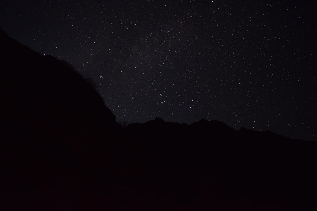 night sky, stars, silhouette of the top left corner of the Andes mountain range, photo taken with Sony Alpha A7 III camera and an EF2845mm f/3.6 lens in the style of Andes mountain range. –ar 128:85