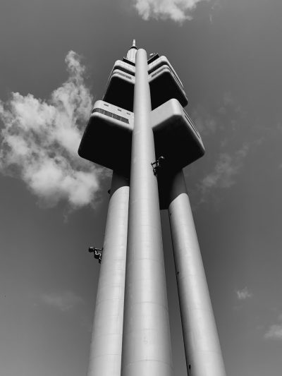 A tall, white brutalist television tower in the style of [Eero Saarinen](https://goo.gl/search?artist%20Eero%20Saarinen). Black and white photo. --ar 3:4