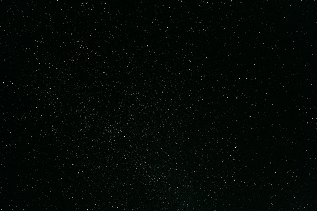 A black sky with stars scattered, viewed from the ground at night. High resolution in the style of cinematography. –ar 128:85