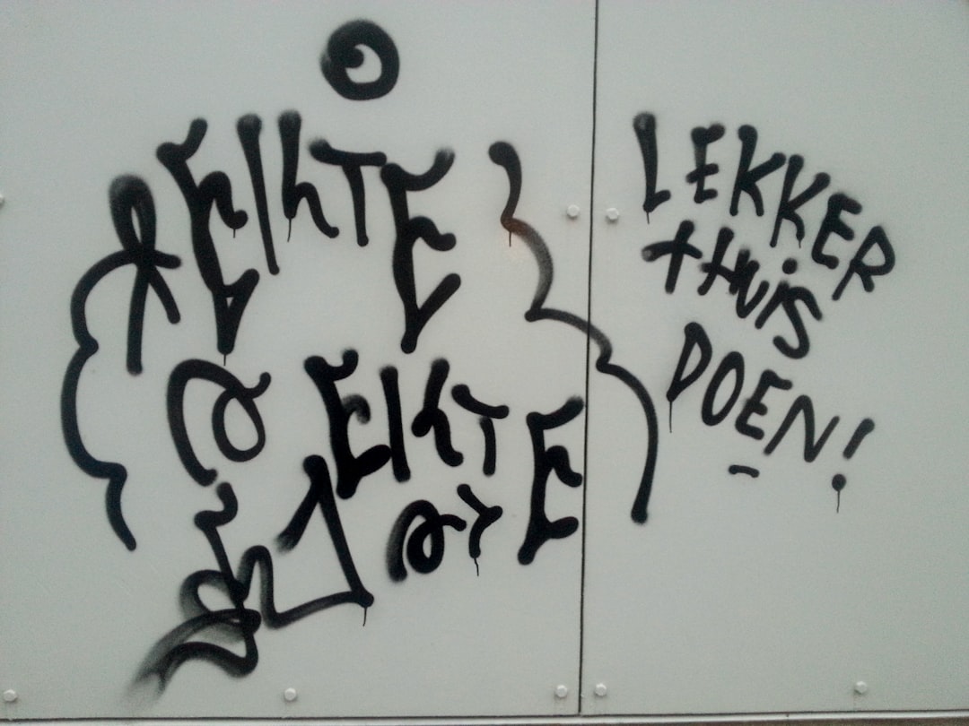 Graffiti text “LWERPs tidee poen!” on a white wall, the letters are black and white in the style of graffiti art, with a dark, dirty, cool, hip hop style. –ar 4:3