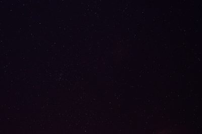 night sky, black background, no stars, taken from the ground, wide angle view. Shots were taken in the style of Anthropic from the ground with a wide angle lens, showing a black night sky with no visible stars. --ar 32:21