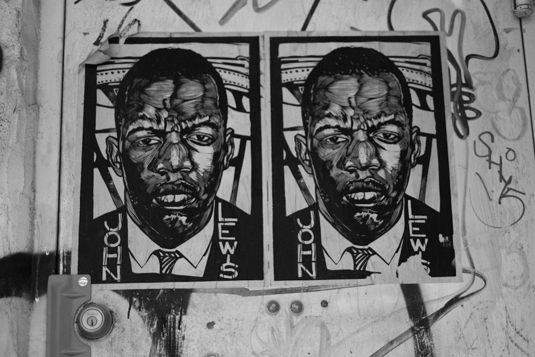 Stencil art of two black and white photos with the name “VECTOR evaluates John LEWIS” on them, in a street style and gritty, urban aesthetic depicting urban decay in the style of graffiti. –ar 128:85