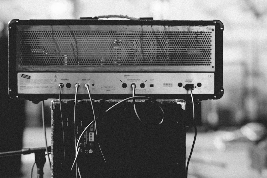 a guitar amp head with several wires hanging out of it, 35mm film grain, fujifilm provia, –ar 128:85