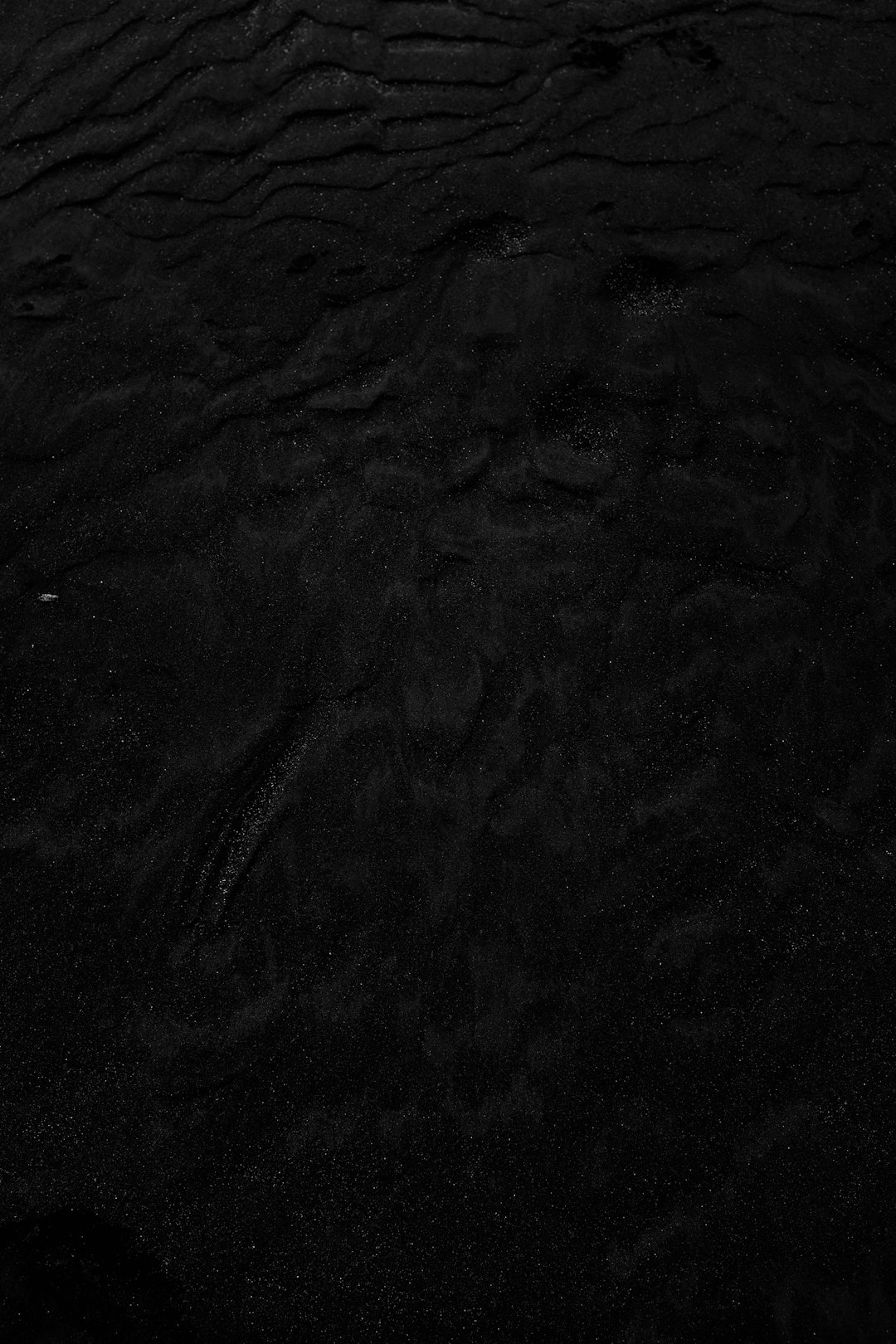 Black sand texture background. Dark beach, top view. Black desert sand texture. Sand dunes on the seashore. Aesthetics of nature, sand in dark sky –ar 85:128