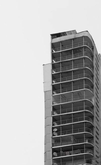 high-rise building, balcony, simple lines, black and white, monochrome, flat colors, architectural photography, side view, perspective --ar 79:128