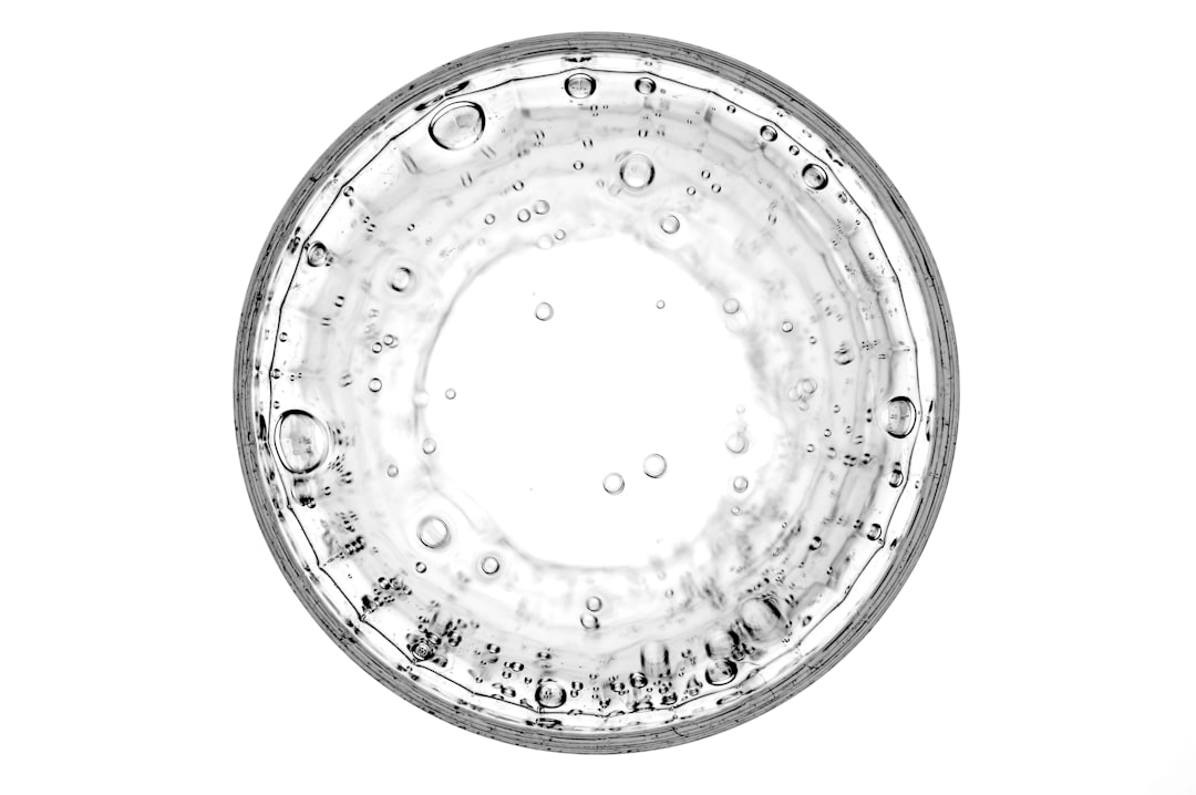 round glass with water and bubbles, top view isolated on white background, –ar 128:85