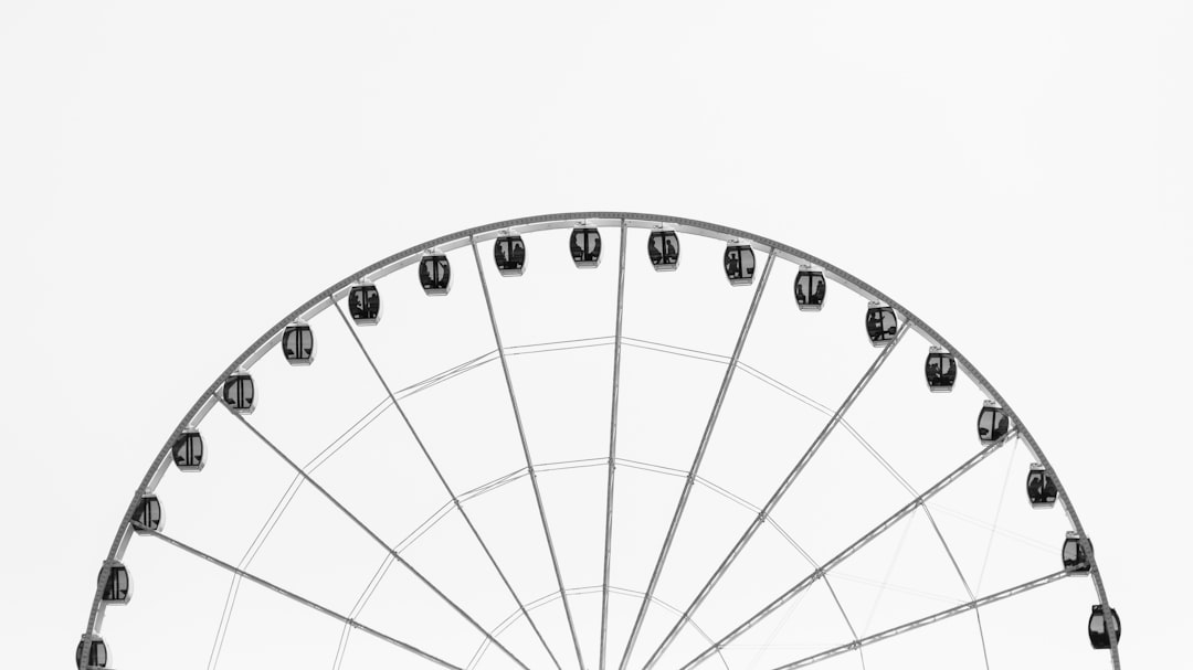 Black and white photo of Ferris wheel on white background, simple, minimalistic, flat lay –ar 16:9