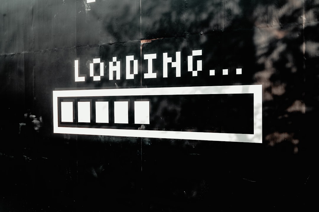 Black and white pixel art of the word “Ionizing” in a loading bar with an empty progress bar, video game aesthetic, minimalistic, simple style on a black background, pixelated. The artwork is done in the style of Ionizing. –ar 128:85