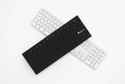 Black and white keyboard, front view, white background, flat lay photography, in the style of product design --ar 128:85